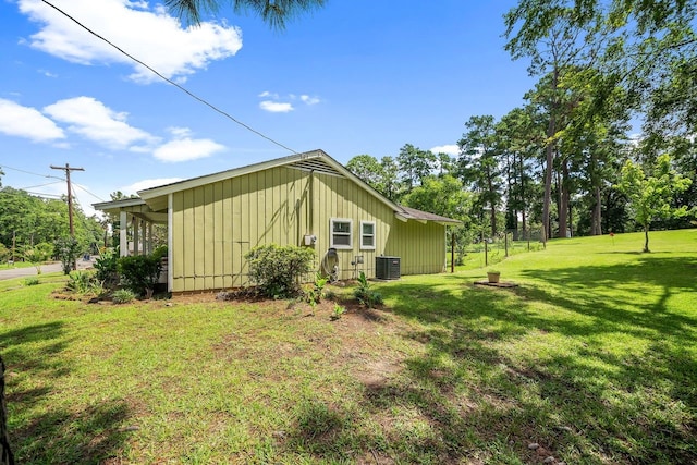 view of home's exterior with a yard and central air condition unit