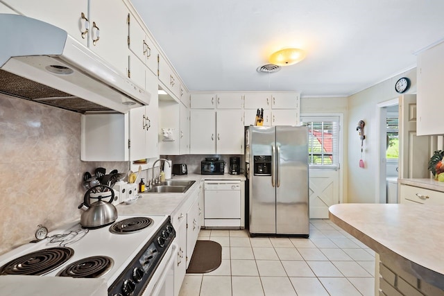 kitchen with stainless steel fridge, white dishwasher, under cabinet range hood, a sink, and range with electric stovetop