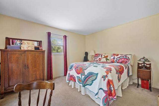 bedroom with carpet and baseboards