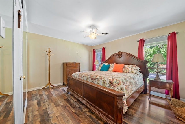 bedroom with dark wood-type flooring, baseboards, and a ceiling fan