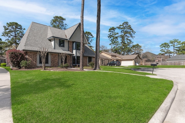 view of front of property with brick siding, a shingled roof, concrete driveway, a front yard, and a garage