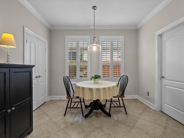 dining area featuring light tile patterned floors, baseboards, and ornamental molding