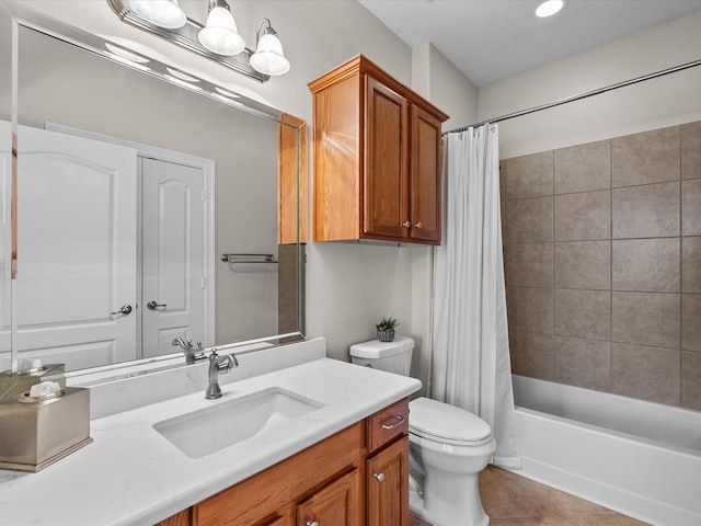 bathroom featuring tile patterned flooring, shower / tub combo, toilet, and vanity