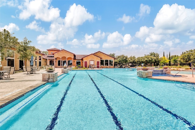 pool with a patio area