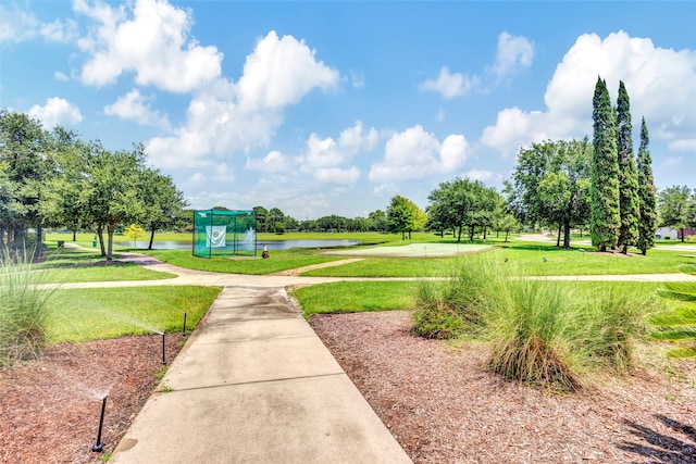 view of community featuring a yard and a water view