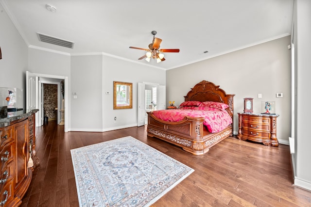 bedroom with a ceiling fan, baseboards, visible vents, dark wood-style flooring, and crown molding