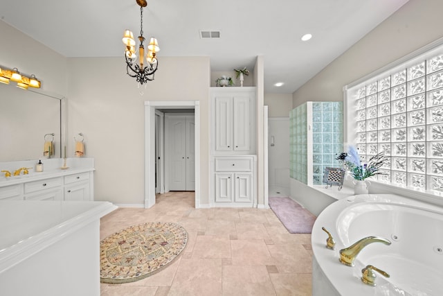 full bathroom with visible vents, a jetted tub, baseboards, an inviting chandelier, and vanity