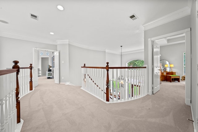 hall featuring crown molding, an upstairs landing, visible vents, and carpet floors