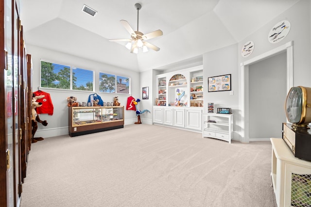 recreation room featuring light colored carpet, baseboards, and lofted ceiling