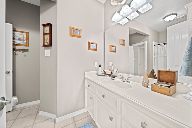 full bath featuring tile patterned flooring, visible vents, vanity, and baseboards