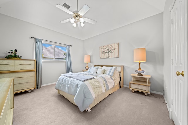 bedroom featuring visible vents, light carpet, baseboards, and a ceiling fan