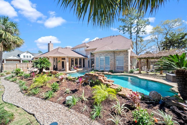 view of swimming pool featuring a fenced in pool, an in ground hot tub, a patio, and fence