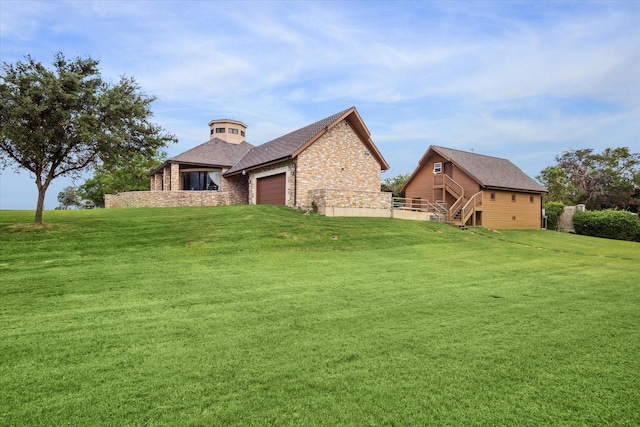 view of front of house with a garage, a front lawn, and brick siding