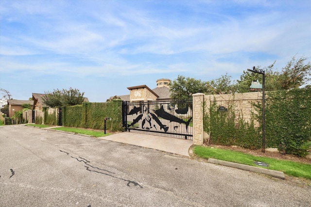 view of gate with fence