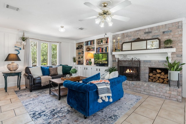 living room with a brick fireplace, ceiling fan, visible vents, and light tile patterned flooring