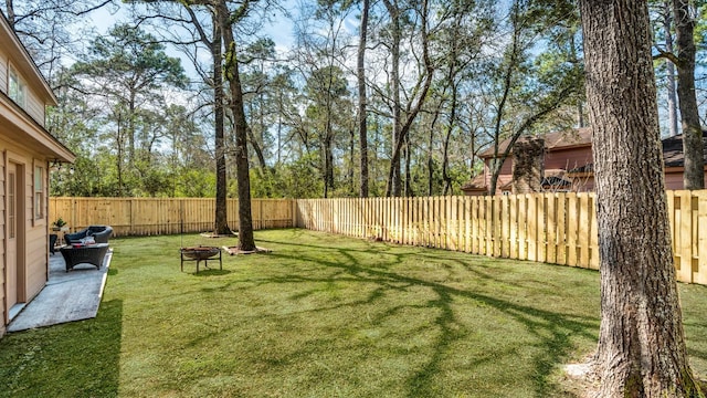 view of yard with a fenced backyard