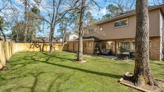 view of yard featuring a patio area and a fenced backyard