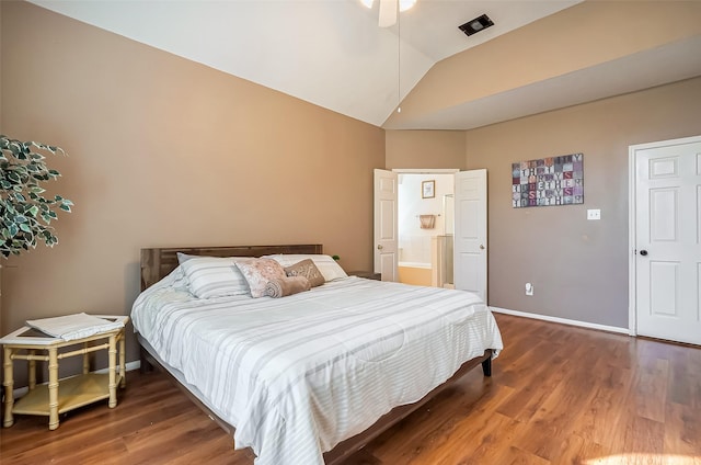 bedroom featuring vaulted ceiling, wood finished floors, and baseboards