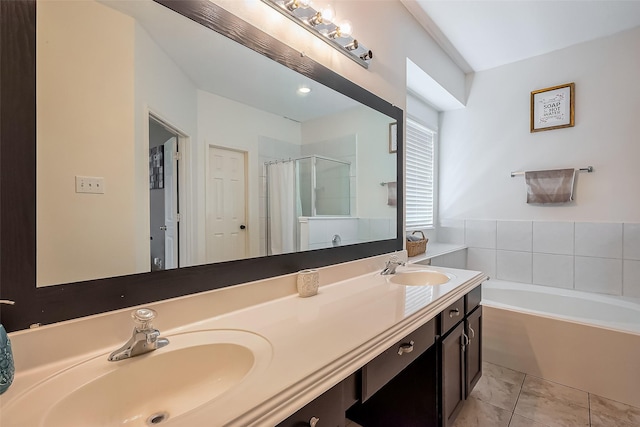 full bathroom featuring double vanity, a stall shower, a garden tub, and a sink