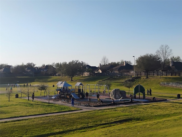 communal playground featuring a lawn