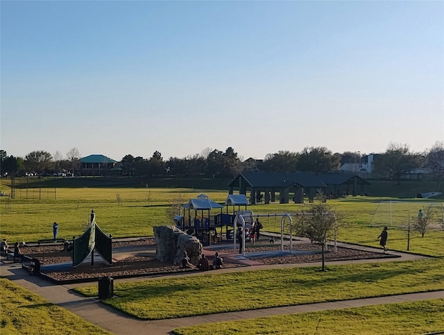 community jungle gym with a lawn