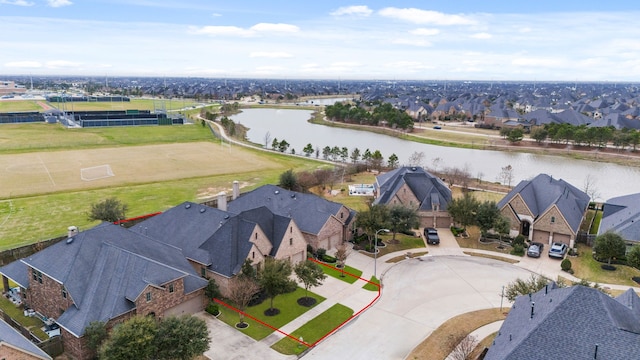 aerial view with a water view and a residential view