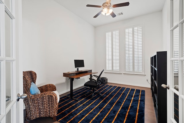 office with french doors, visible vents, ceiling fan, and wood finished floors