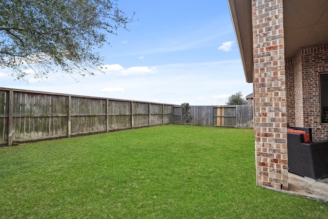 view of yard with a fenced backyard