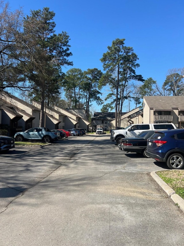 view of road featuring curbs and a residential view