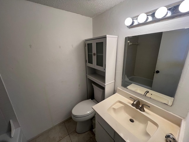 bathroom featuring toilet, tile patterned floors, a textured ceiling, vanity, and shower / bathing tub combination