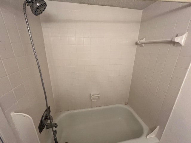 bathroom with shower / tub combination