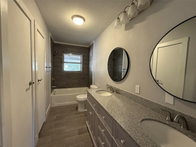 full bath featuring shower / washtub combination, wood tiled floor, a sink, and toilet