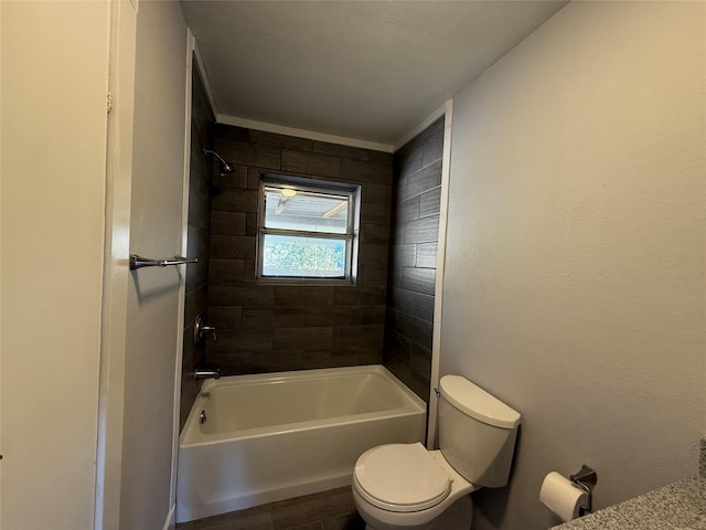 bathroom featuring bathing tub / shower combination and toilet