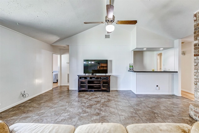 tiled living room featuring ceiling fan, visible vents, vaulted ceiling, and baseboards