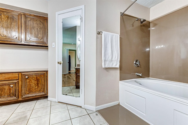 bathroom featuring baseboards, shower / bath combination, and tile patterned floors