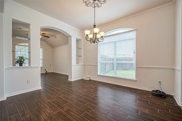 unfurnished room with wood finish floors, plenty of natural light, and ceiling fan with notable chandelier