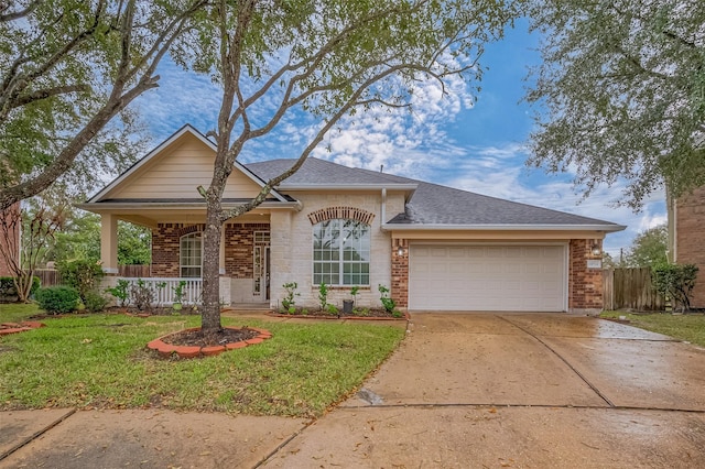 single story home with brick siding, covered porch, concrete driveway, a front yard, and a garage