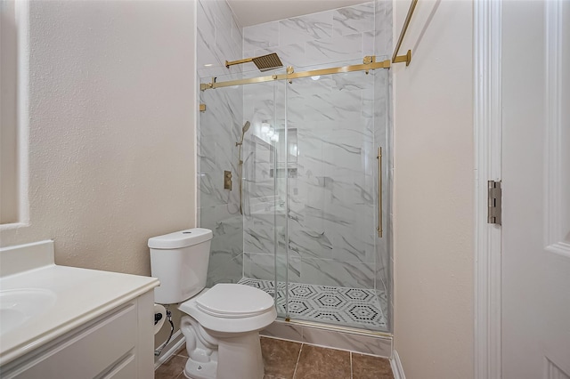 10714 Barker Lake Ct, Cypress, TX 77433 - bathroom with vanity, a marble finish shower, toilet, tile patterned flooring, and baseboards