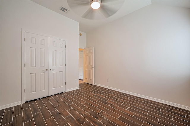 10714 Barker Lake Ct, Cypress, TX 77433 - unfurnished bedroom featuring wood finish floors, lofted ceiling, baseboards, a closet, and ceiling fan