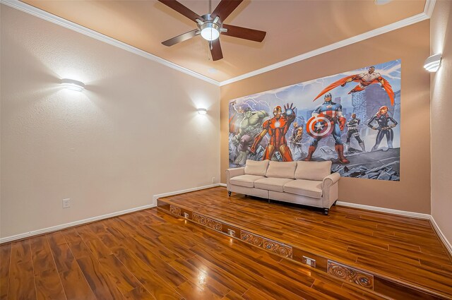 unfurnished room featuring baseboards, wood finished floors, a ceiling fan, and crown molding