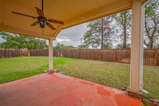 view of yard with a ceiling fan, a patio area, and a fenced backyard