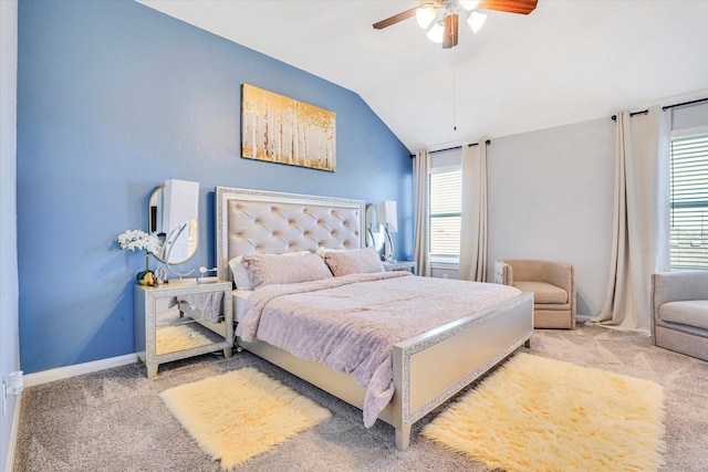 bedroom with light carpet, multiple windows, vaulted ceiling, and baseboards