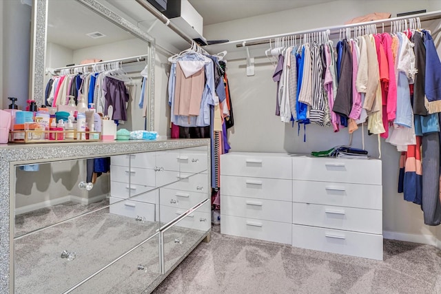 spacious closet featuring visible vents and carpet flooring