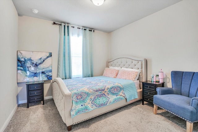 bedroom featuring carpet floors and baseboards