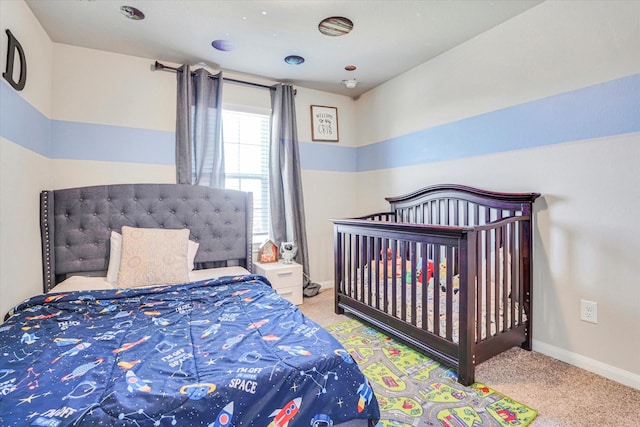 bedroom featuring carpet floors and baseboards