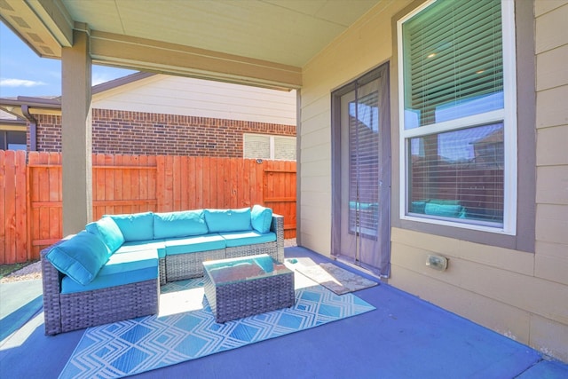 view of patio with fence and an outdoor living space