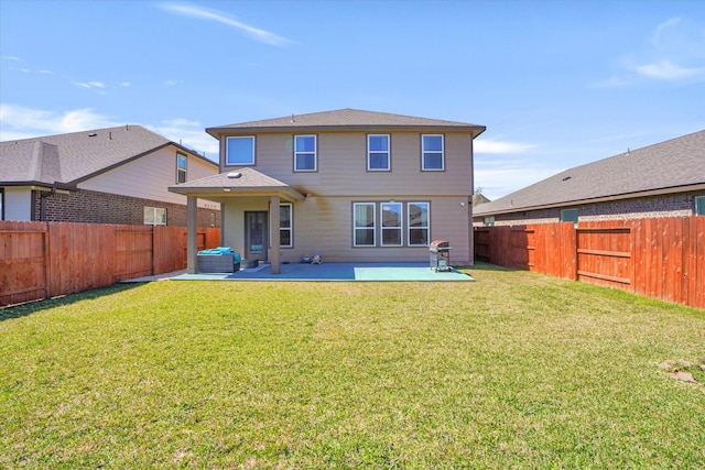 back of house featuring a yard, a patio, and a fenced backyard