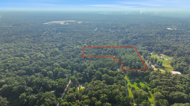 aerial view featuring a forest view