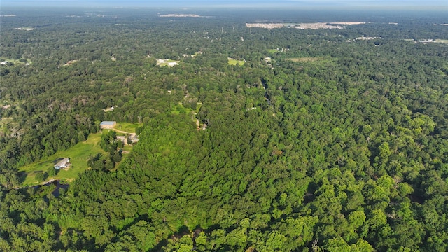 bird's eye view featuring a wooded view