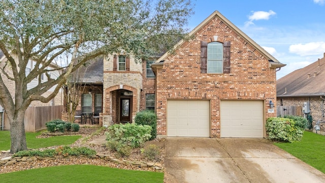 view of front of property featuring driveway, an attached garage, fence, and brick siding